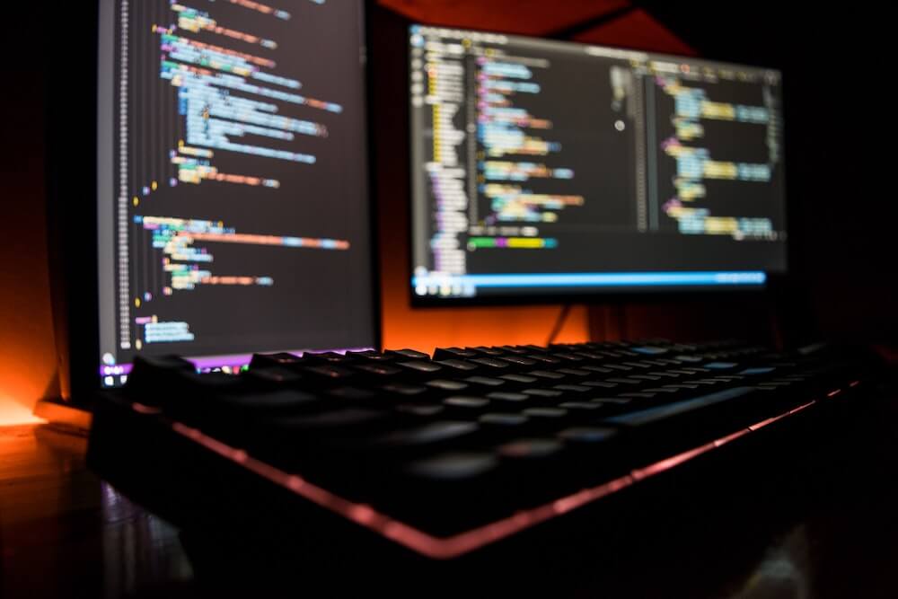 computer screen in dark mode with code