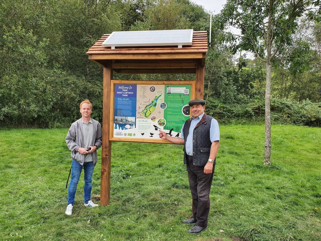 Members of the Bedlinog community pose with the Info Point digital sign